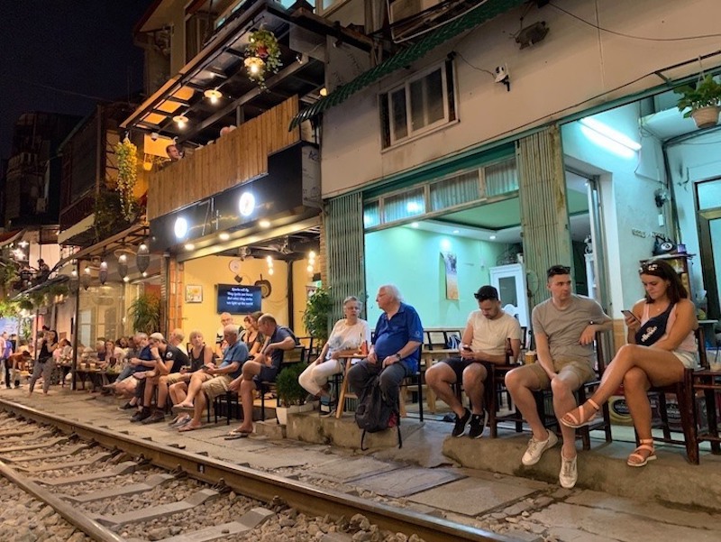 Sip coffee by the tracks